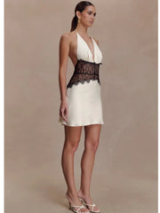 Elegant white mini dress styled with contrasting lace detail