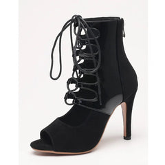 Black high-heeled shoe with lace-up design on a white background