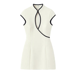 White sleeveless dress with black accents on a white background