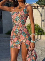 Woman wearing a colorful patterned dress standing outdoors.