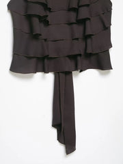 Dark brown strapless dress with ruffled layers on a white background