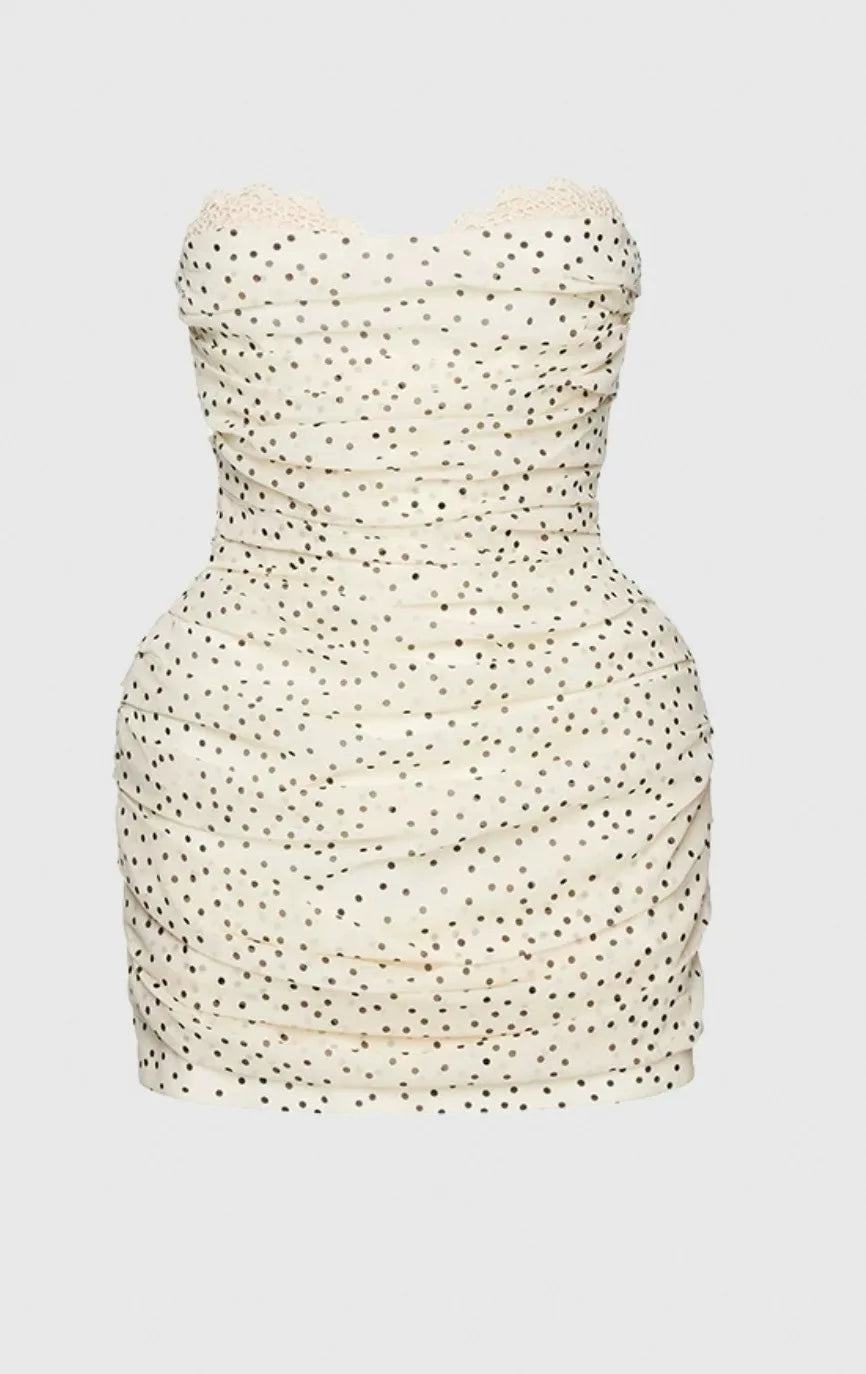 Strapless dress with a subtle pattern on a light gray background