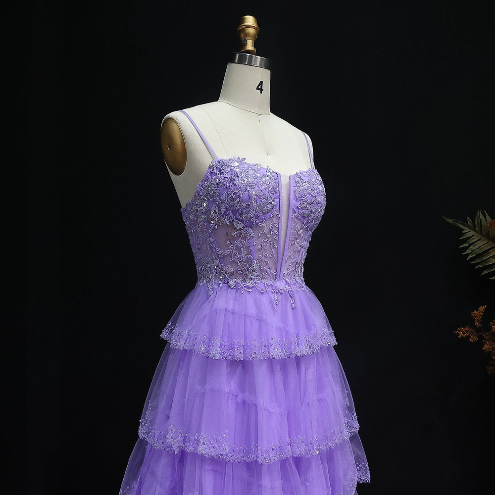 Purple evening gown on a mannequin against a black background