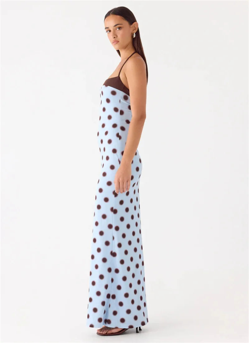 Woman wearing a polka dot dress on a white background