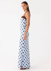 Woman wearing a polka dot dress on a white background