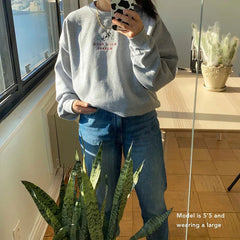 Women's sweatshirt with a cactus and "Hold Your Horses" embroidery.