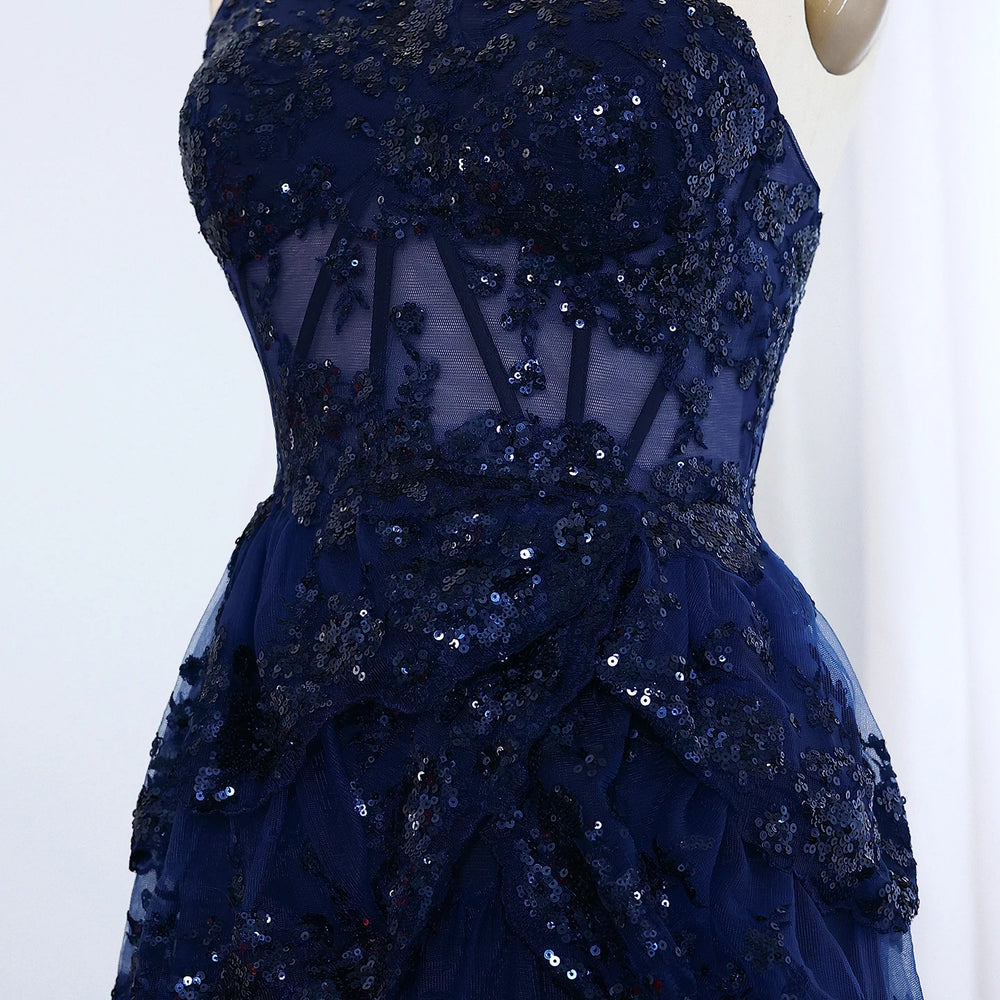 Navy blue sequin dress on a mannequin against a white background