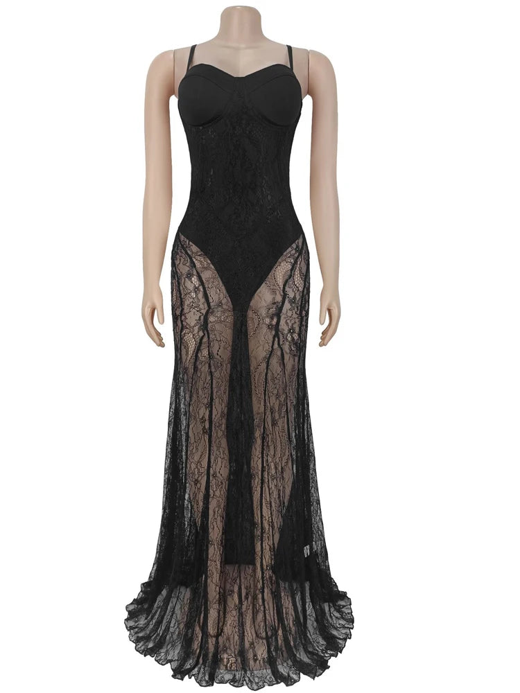 Black lace evening gown on a mannequin against a white background