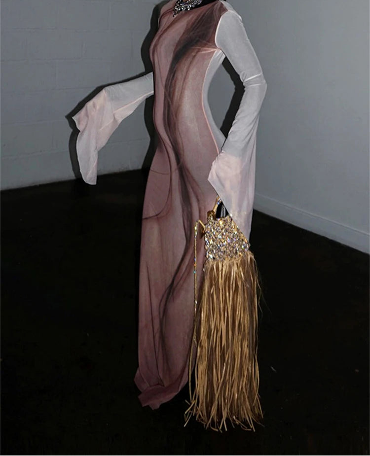 Back view of sheer mesh maxi dress with bell sleeves and abstract print