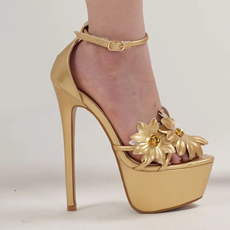Gold high-heeled shoe with floral design 