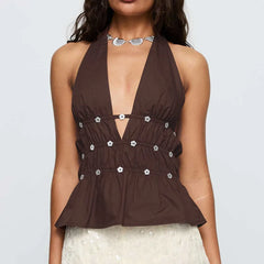 Brown halter top with silver buttons on a plain background