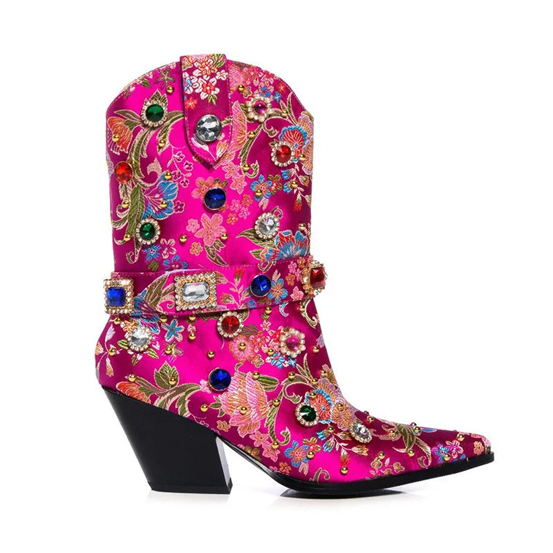 Fuchsia embroidered pointed toe boots with rhinestones and a block heel.