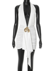 White vest with a gold brooch on a mannequin against a white background