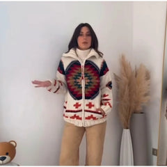 Model wearing a cream-colored patchwork zip-up coat