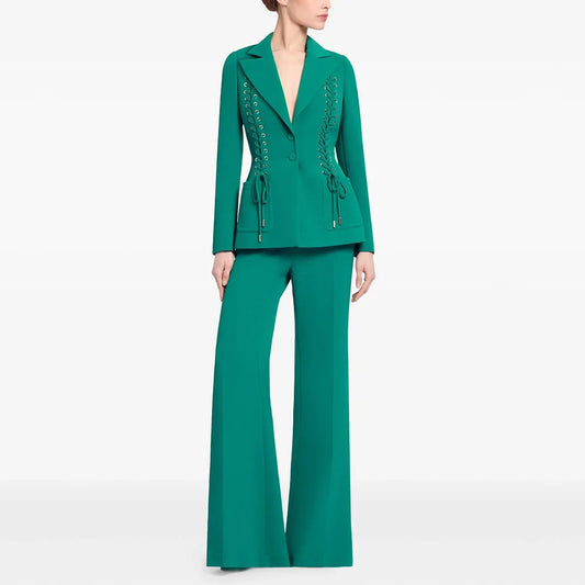 Green lace-up blazer and flared pants suit on a model