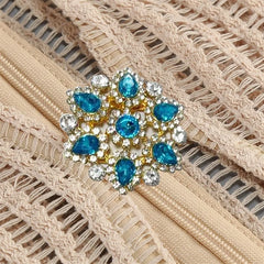 Detail of crystal and stone embellishment on dress zipper