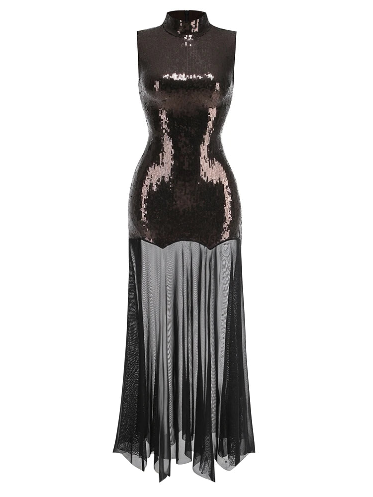 Black sequin dress with sheer overlay on a white background