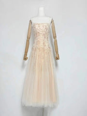 Floral embroidered tulle square neck dress on mannequin