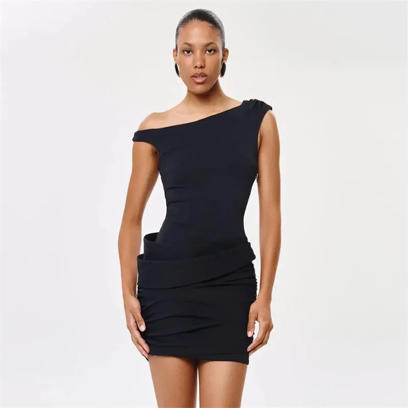 Black inclined shoulder ruched mini dress studio shot