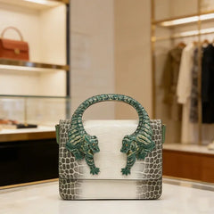 White and grey embossed leather handbag with sculpted tiger handle