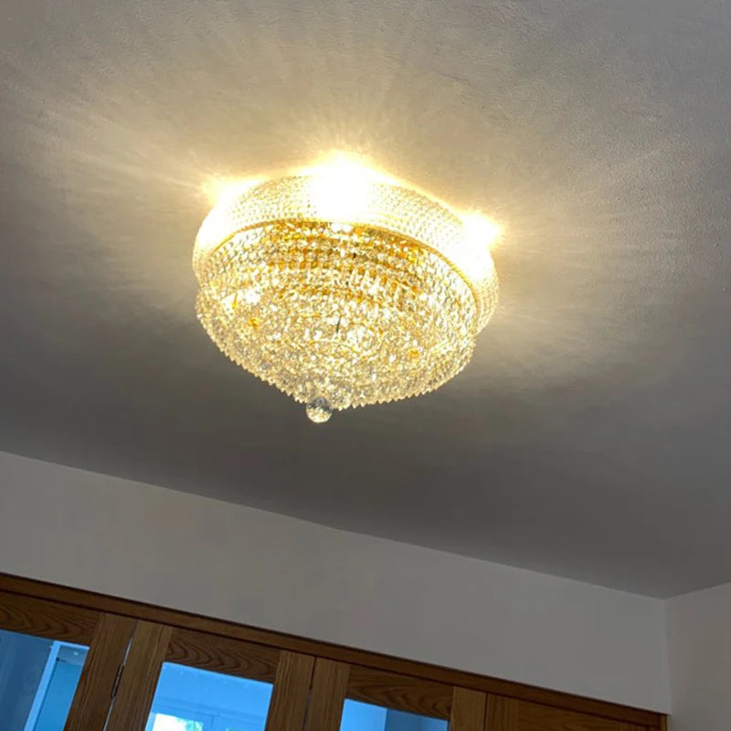 Antique silver crystal chandelier with lace frame and sparkling drops in elegant living space