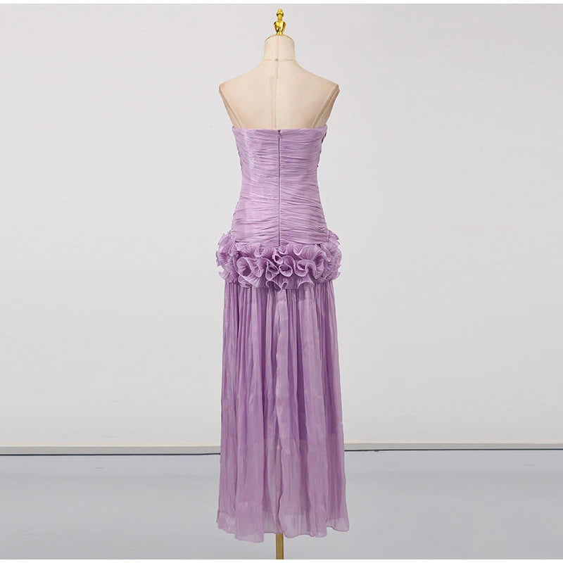 Purple strapless gown with floral details on a mannequin against a white background
