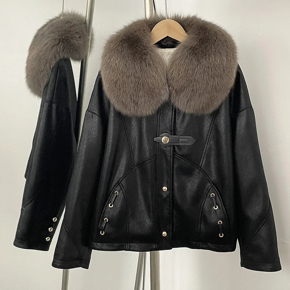 Black leather jacket with fur collar on a hanger against a neutral background