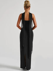 Black sleeveless dress with open back on a white background