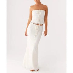 White strapless top and wide-leg pants on a white background