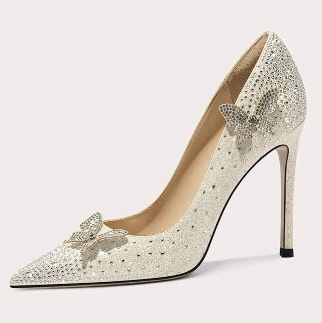 High-heeled shoe with decorative bow on a white background