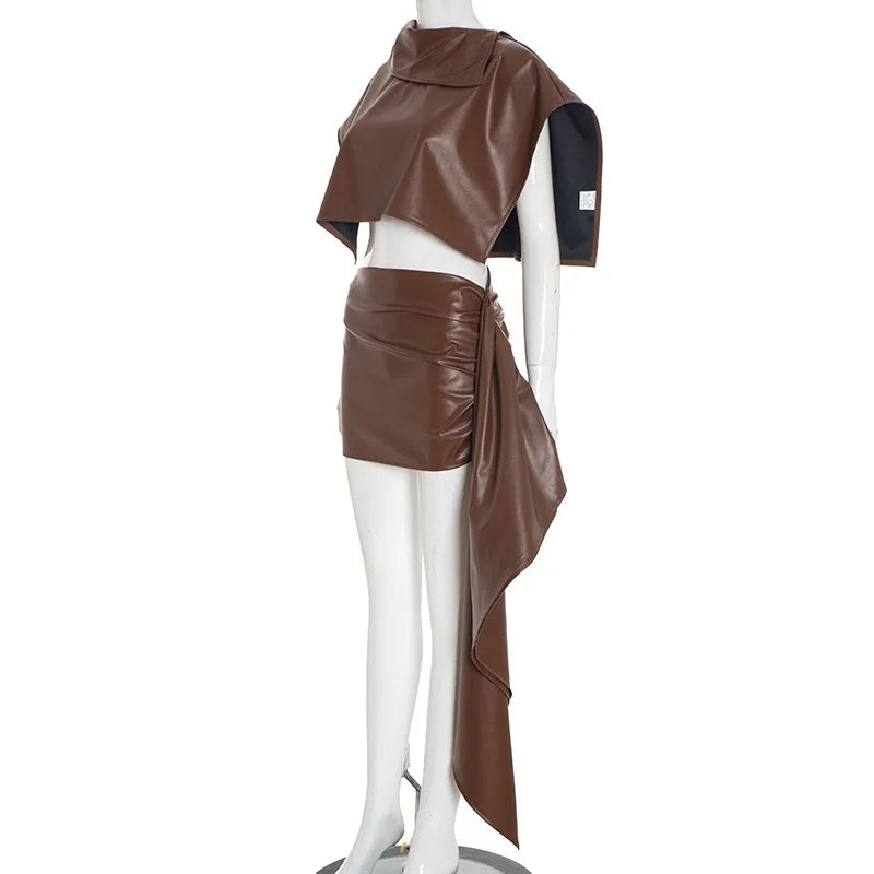 Brown leather outfit on a mannequin against a white background
