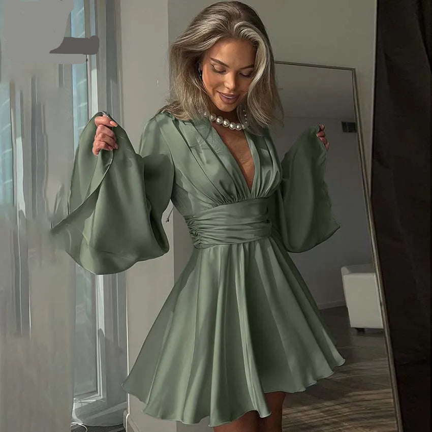 Woman wearing a green dress holding a matching handbag, with Coymimi branding.