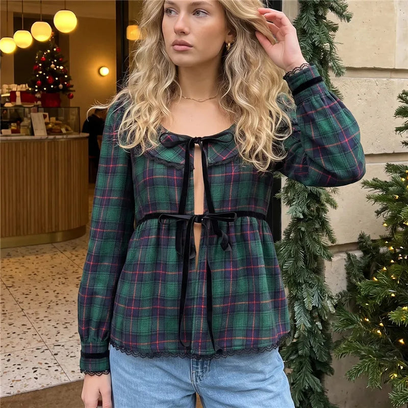 Green plaid long sleeve peplum top with velvet bow tie and Peter Pan collar on model