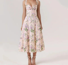 Woman wearing a floral dress on a white background