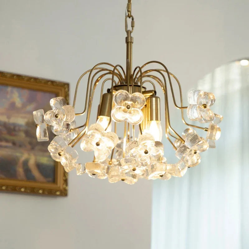 A beautiful antique petal glass chandelier hanging in a dining room, showcasing its intricate design and warm lighting.  Golden Atelier 1