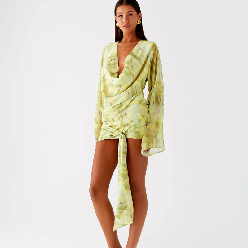 Woman wearing a light green tie-dye dress 