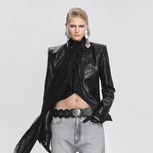 Model wearing an embossed faux leather fitted blazer