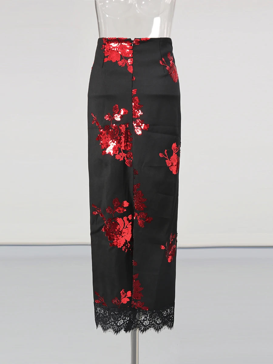 Black pants with red floral sequin embellishments on a mannequin against a white background