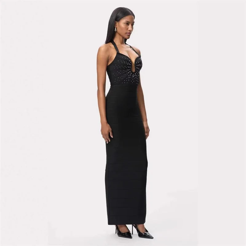 Side profile of a black bandage gown with a halter neckline and crystal bodice