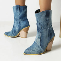 Blue denim boots with wooden soles on a light background