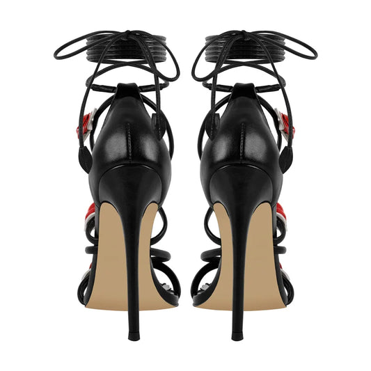 Back view of black lace-up stiletto heeled sandals with rose details.