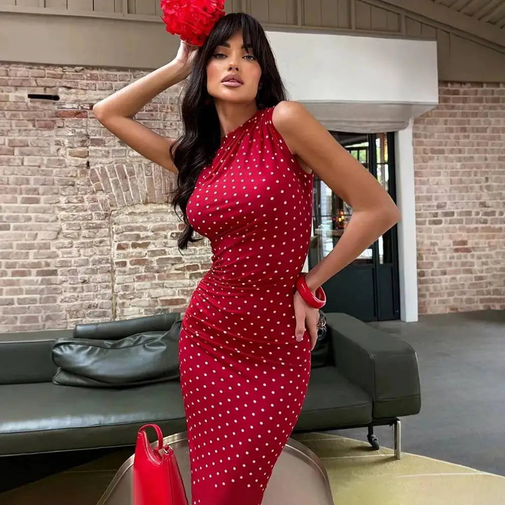 Detail of a red polka dot ruched column maxi dress.