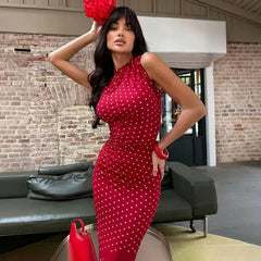 Detail of a red polka dot ruched column maxi dress.