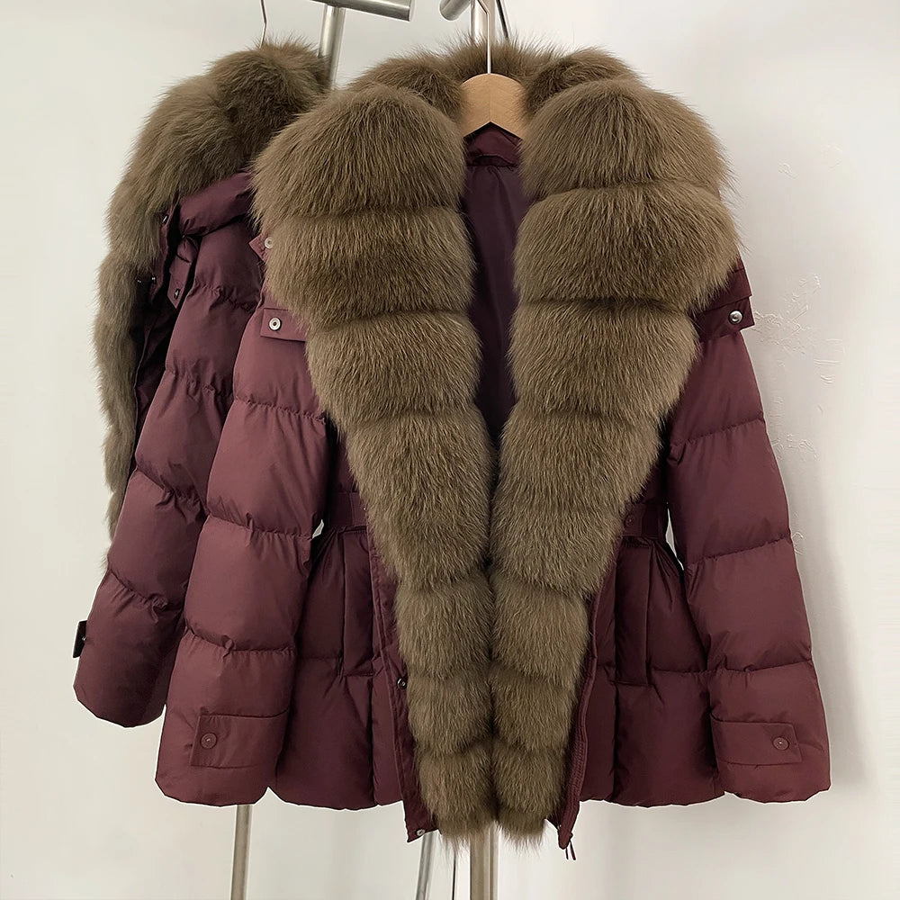 Maroon puffer jacket with fur trim on a hanger 