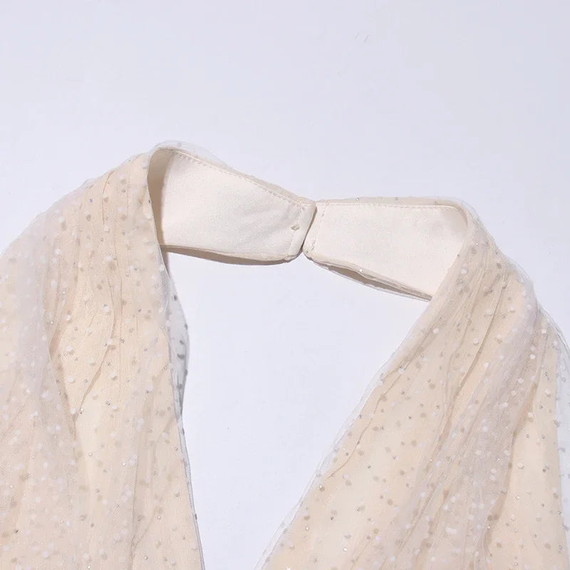 Close-up of a beige fabric with a collar on a light gray background