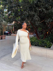 Model wearing a cream one shoulder midi dress