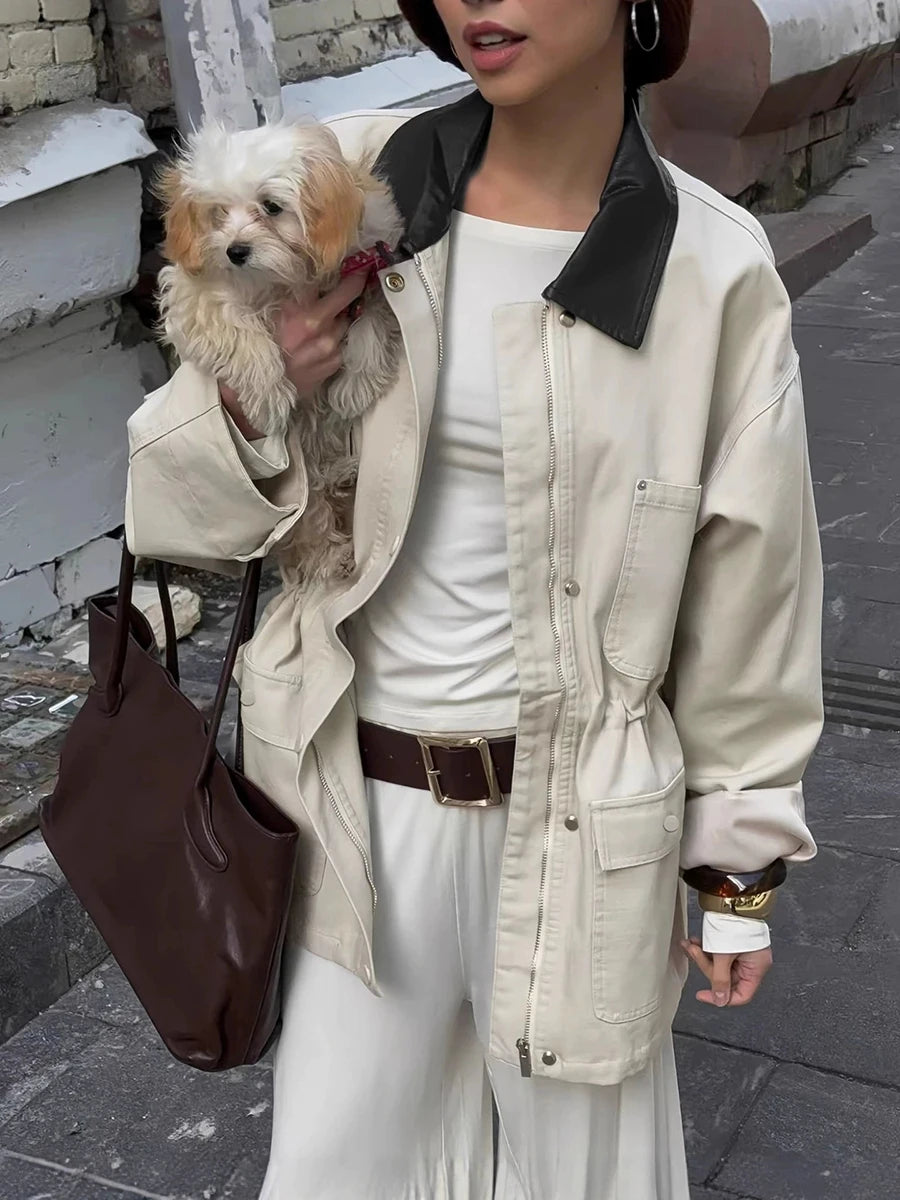 Close-up of drawstring waist utility jacket with black collar