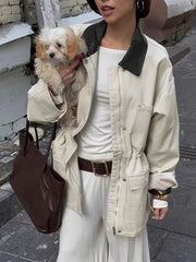 Close-up of drawstring waist utility jacket with black collar
