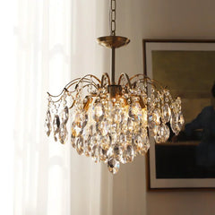  Close-up detail of the sparkling crystals and elegant curves of the chandelier. Golden Atelier 3