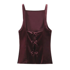 Velvet tank top with a bow detail on the back.